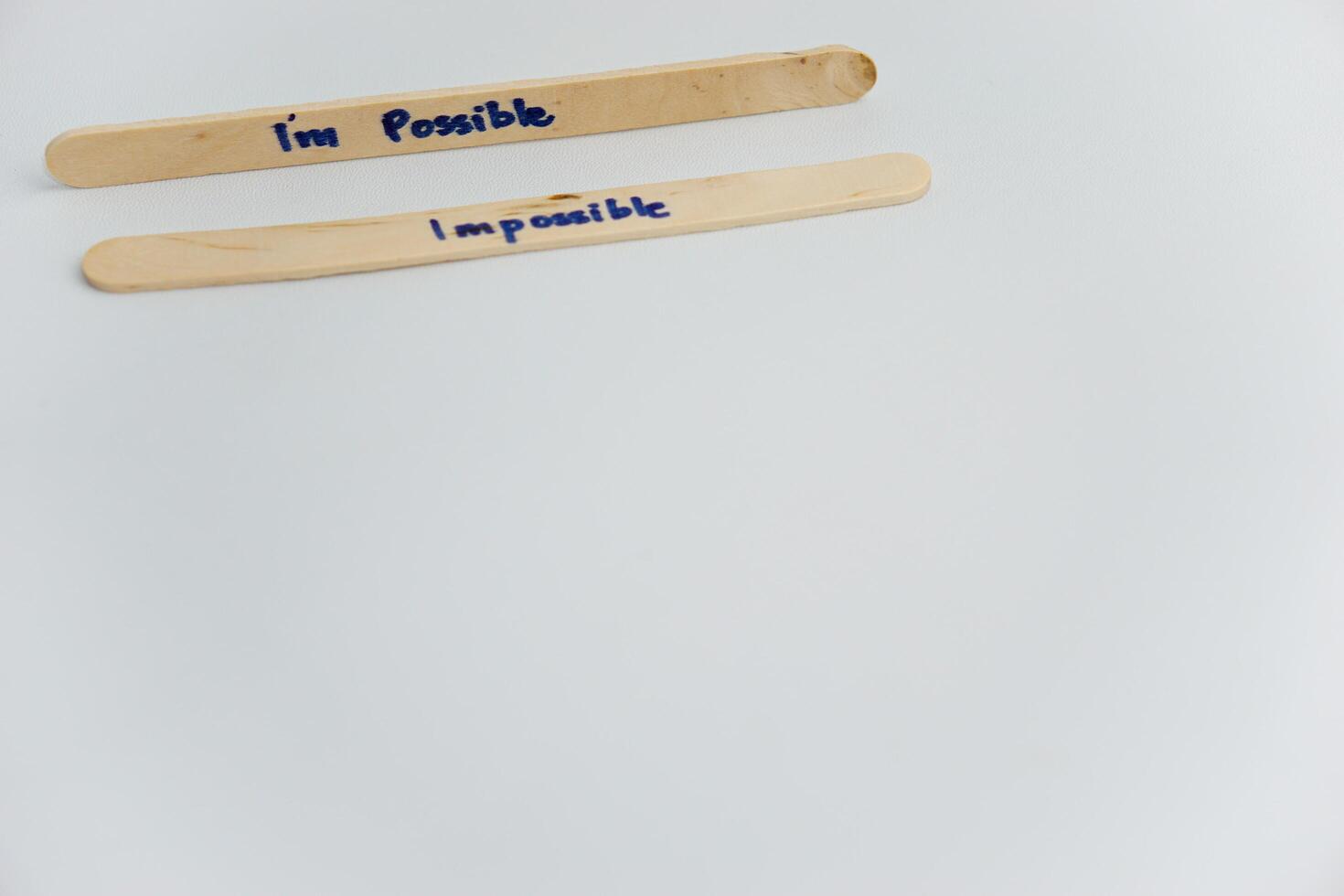 handwriting messages on ice cream sticks in close-up as a concept for building self-esteem photo
