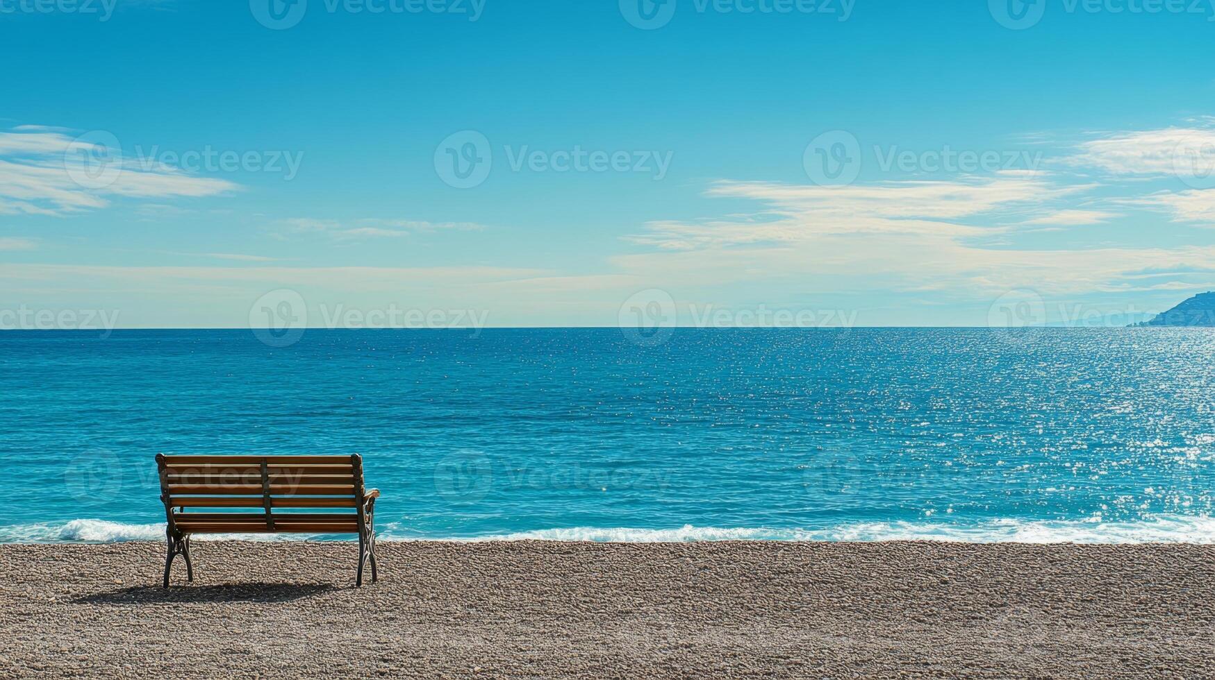Tranquil Beach Scene with Wooden Bench photo