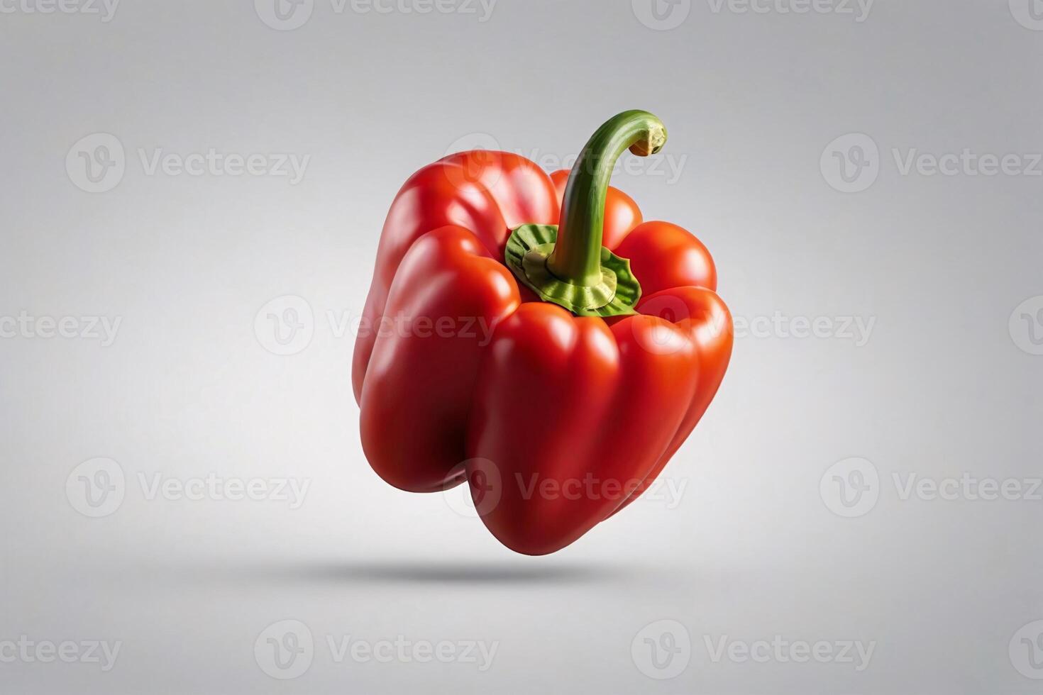A single red bell pepper, isolated on a gray background, with a soft shadow below. photo