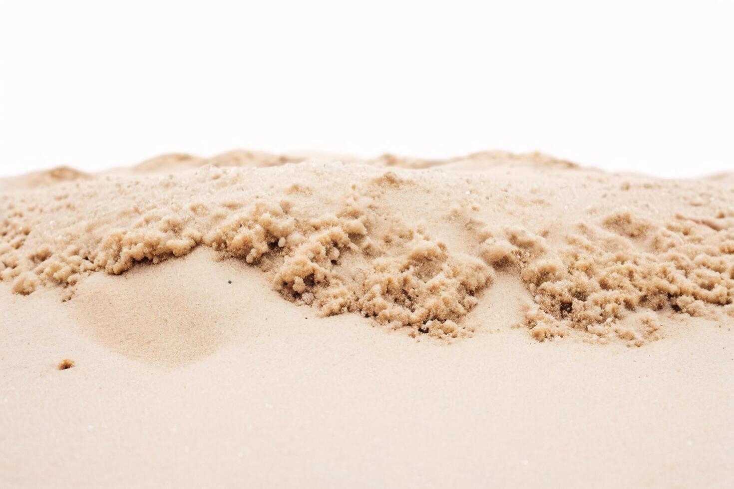 Close-up of textured sand with a white background. photo