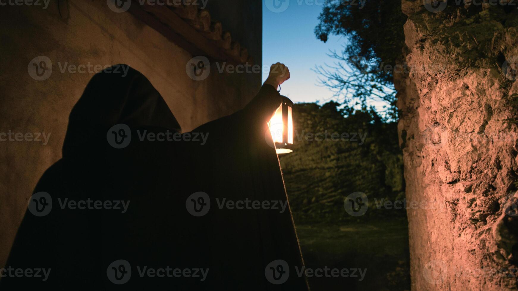 Lantern Mason Wanders the Cobblestone Paths photo