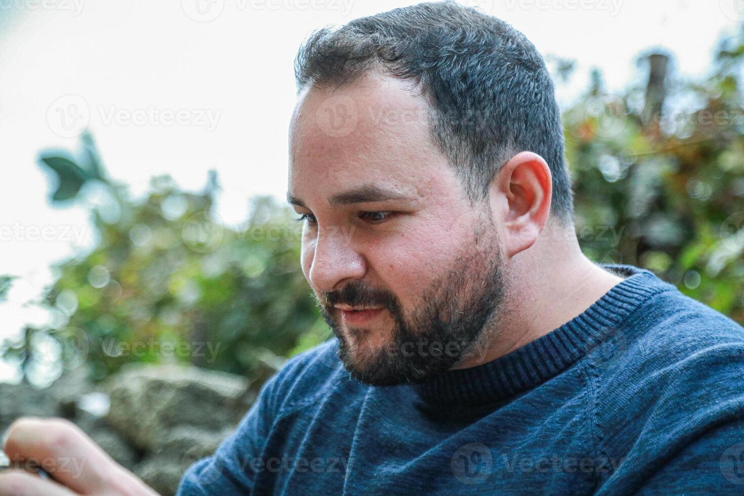 Excited Man Engaged in Smartphone Gaming photo