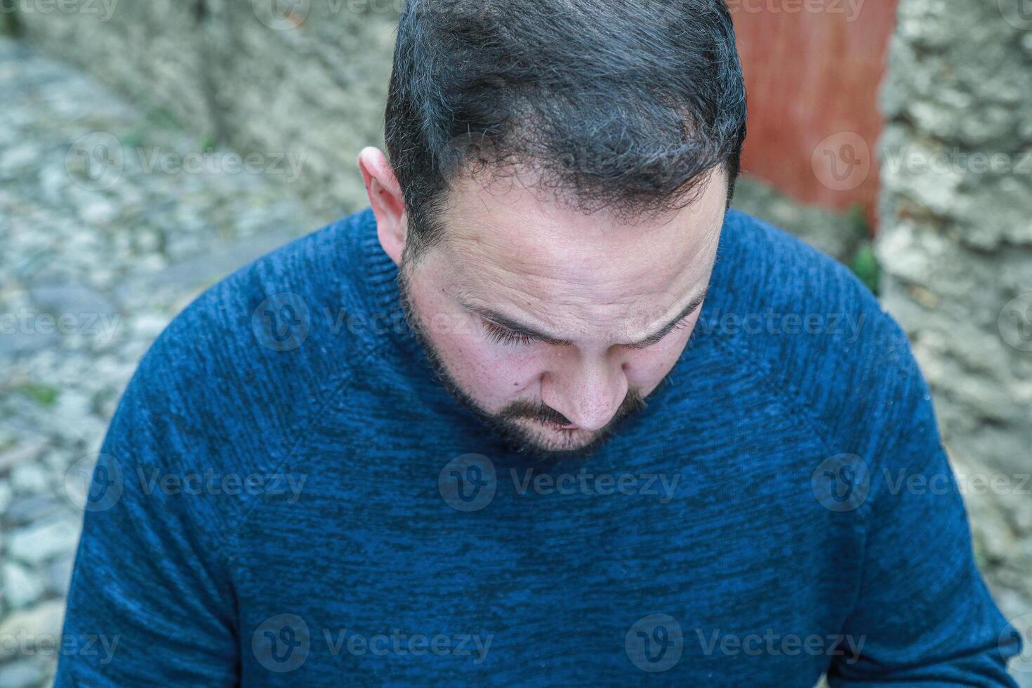 Angry Man Looking Down WIth The Eyes photo