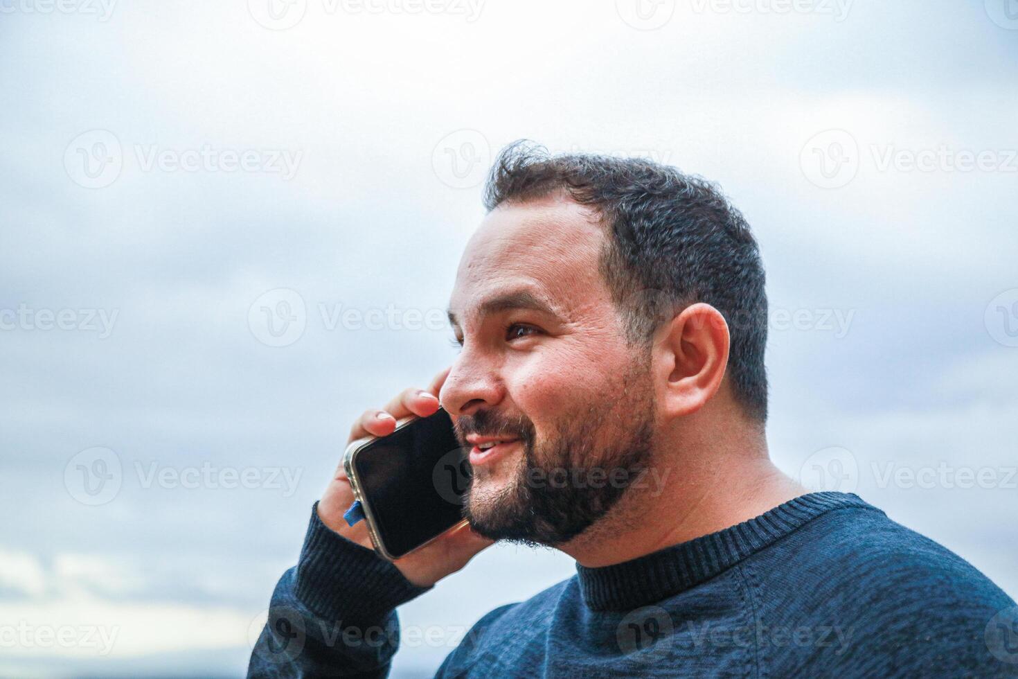 Man Radiates Joy During a Phone Conversation photo