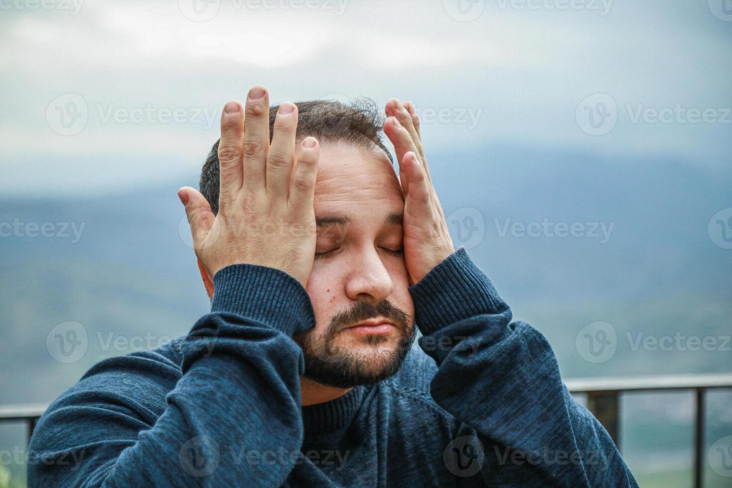 Sweltering Heat Leaves Man Drained Outdoors photo