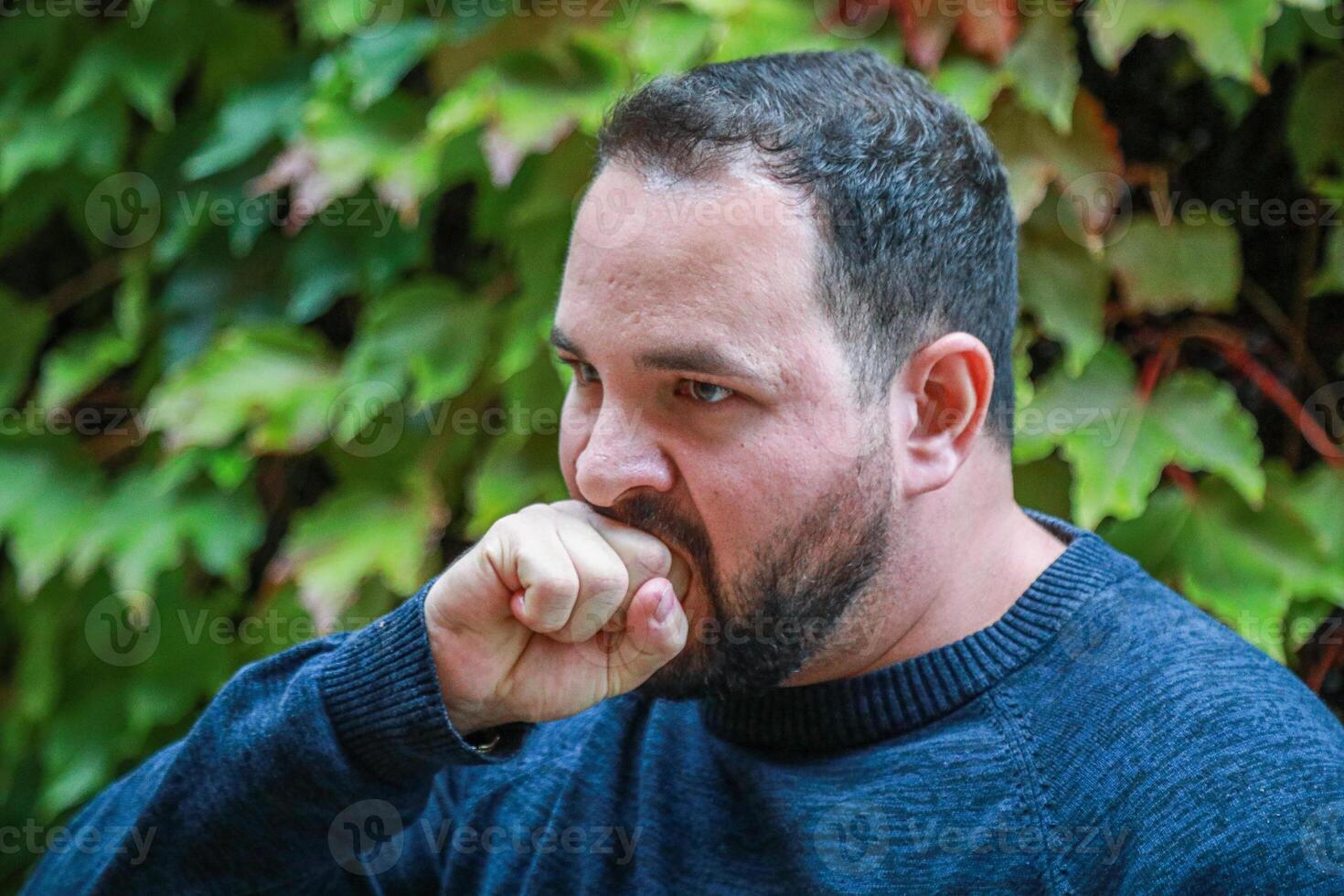 Man Pulling Out All Of His Anger photo