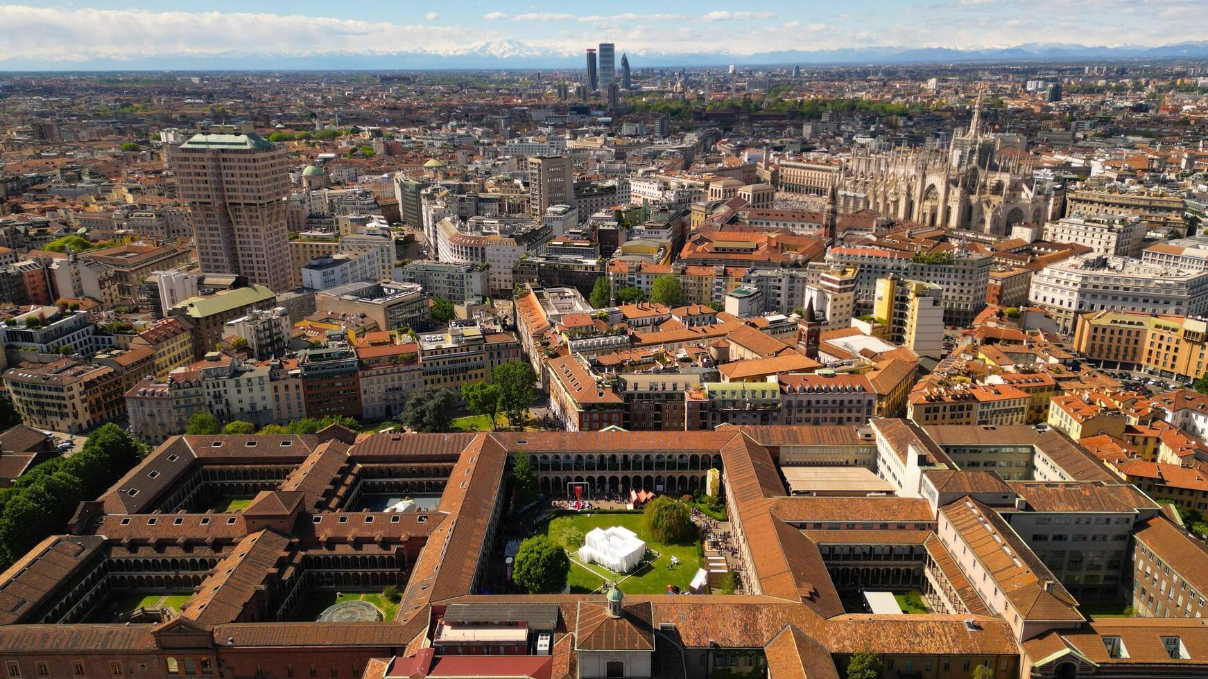 Drone photo University of Milan during Milano Design Week 2024. Multidisciplinary university occupying several historical buildings, with a botanical garden and an observatory. Italy,Milan 20.04.2024