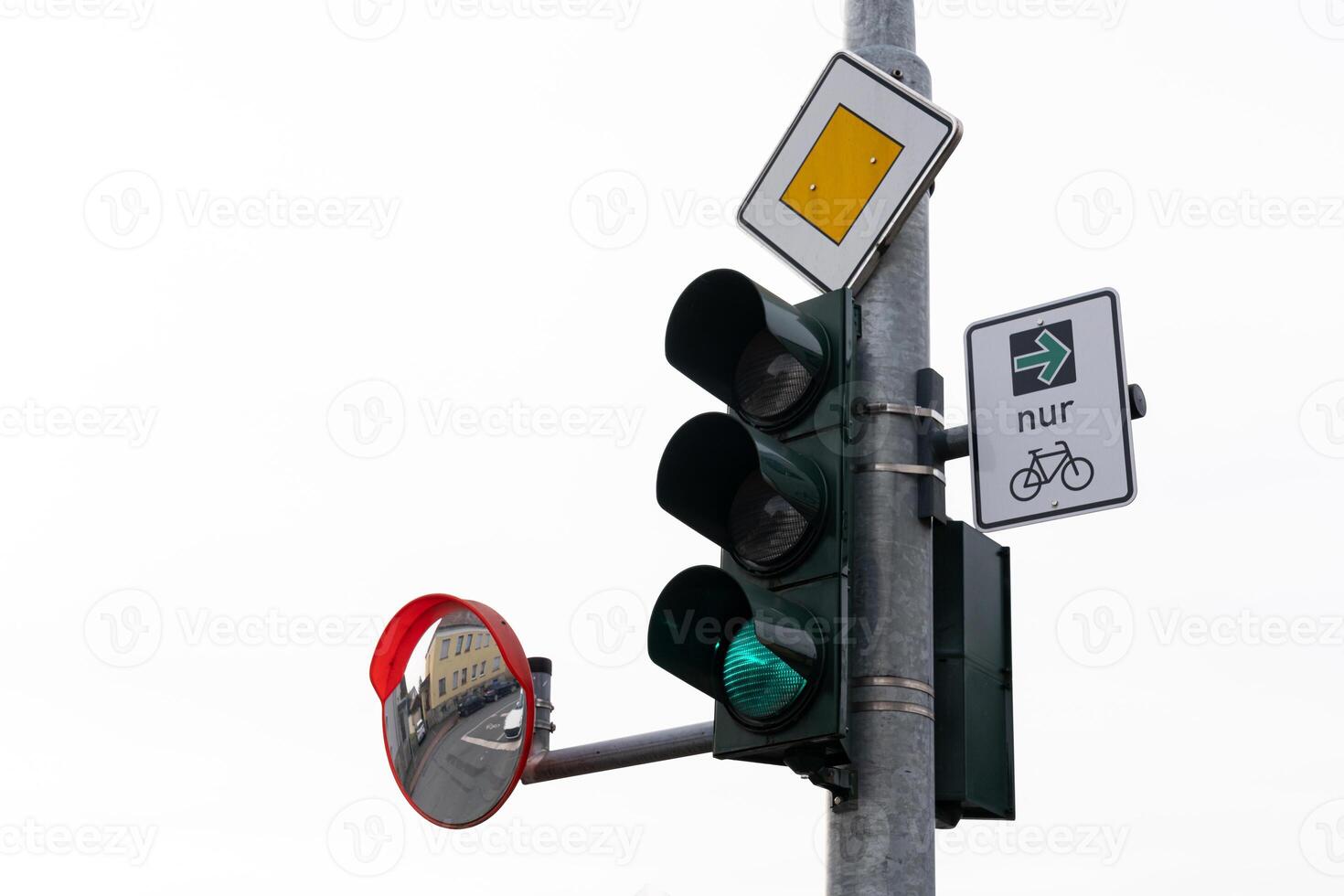 A traffic light showing green, with a bicycle sign indicating a bike photo