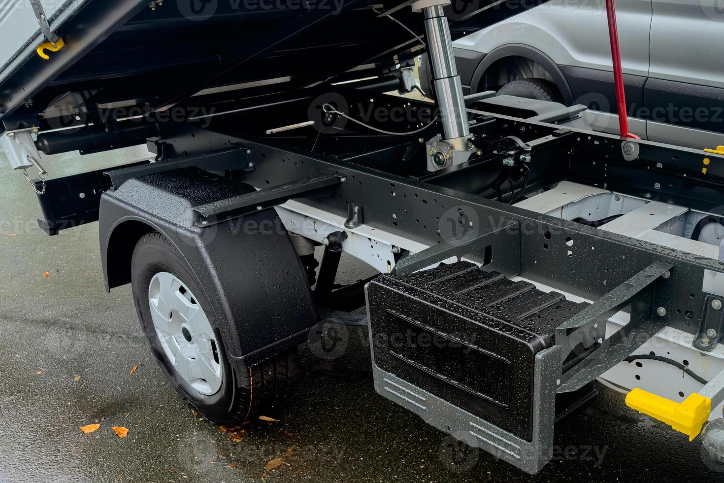 Detailed view of a truck trailer showing hydraulic lift system photo