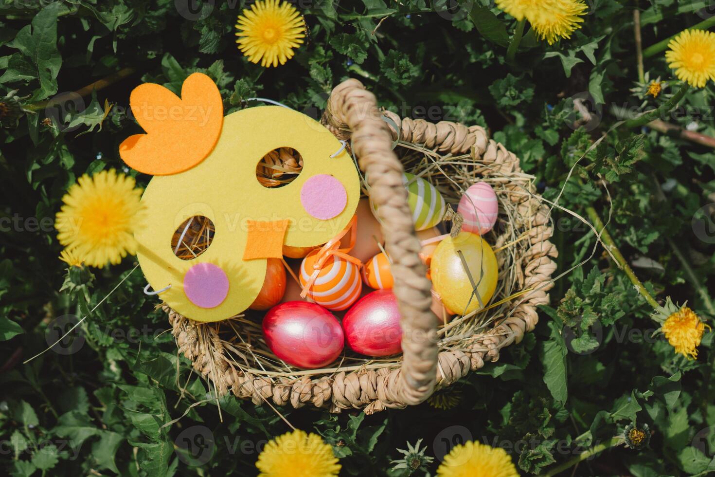 A basket of colorful Easter eggs. Hunting for Easter eggs photo