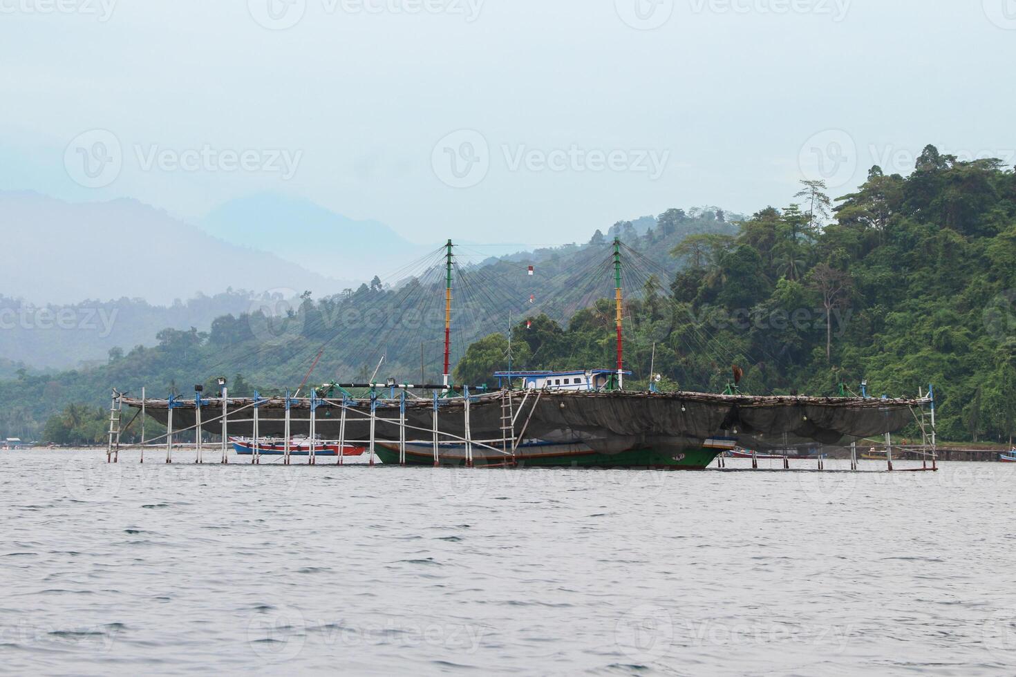 Traditional Indonesian fishing boats, boats and vessels in the waters of the Lampung region, Indonesia photo