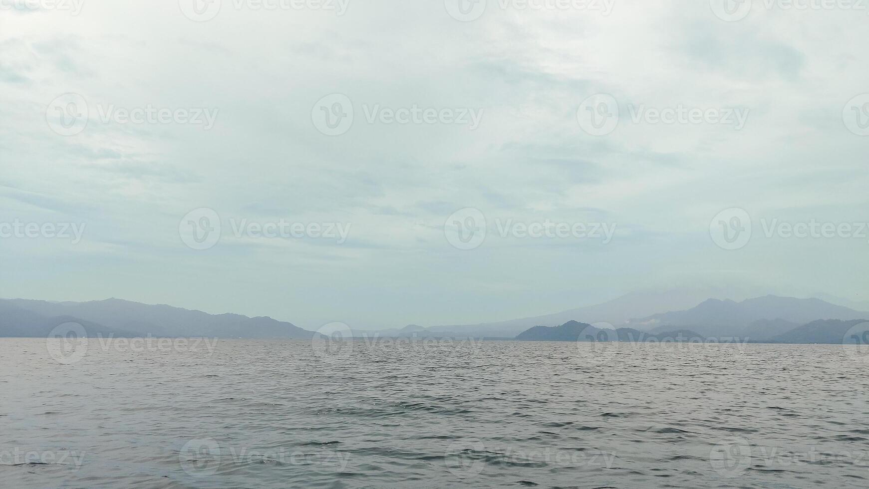 beautiful view of the tropical beach of Pahawang Island, Lampung. Landscape in the highland natural park. Panoramic view by the sea. photo