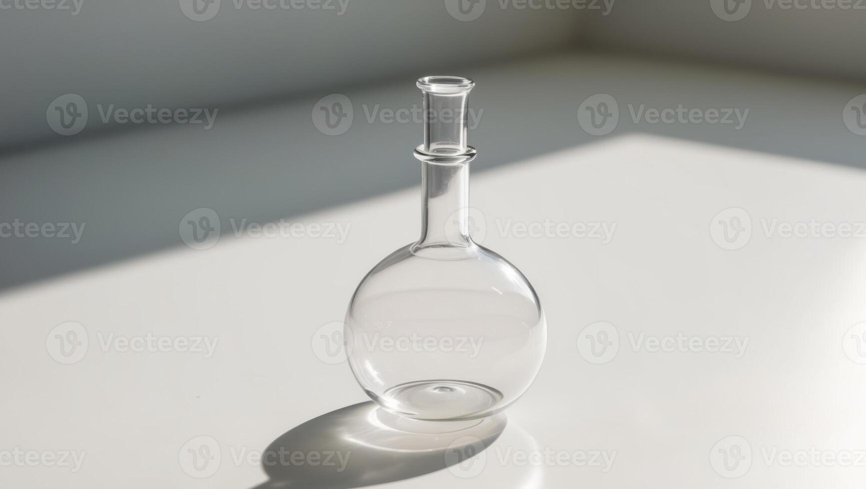 A glass vase with a small object inside photo