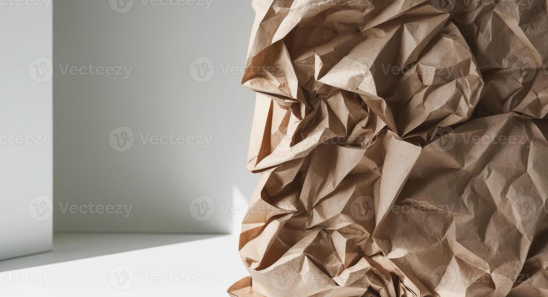 A brown paper bag is sitting on a white floor photo