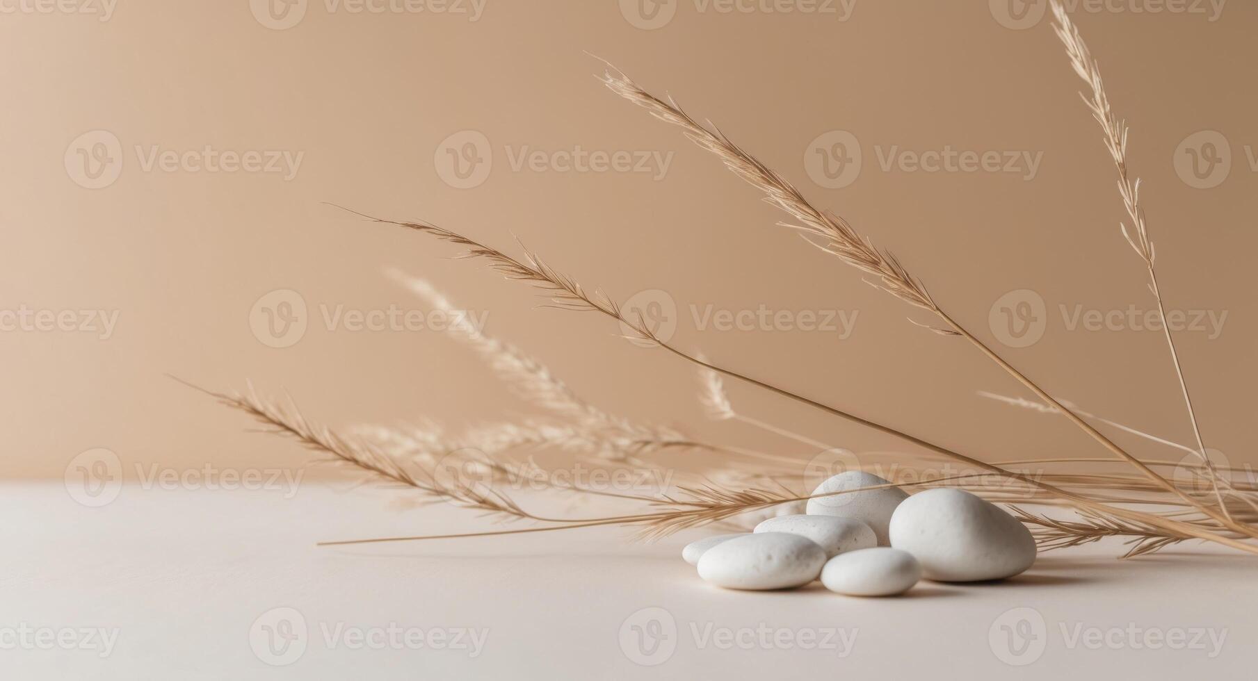 Three white eggs on a table with some grass photo