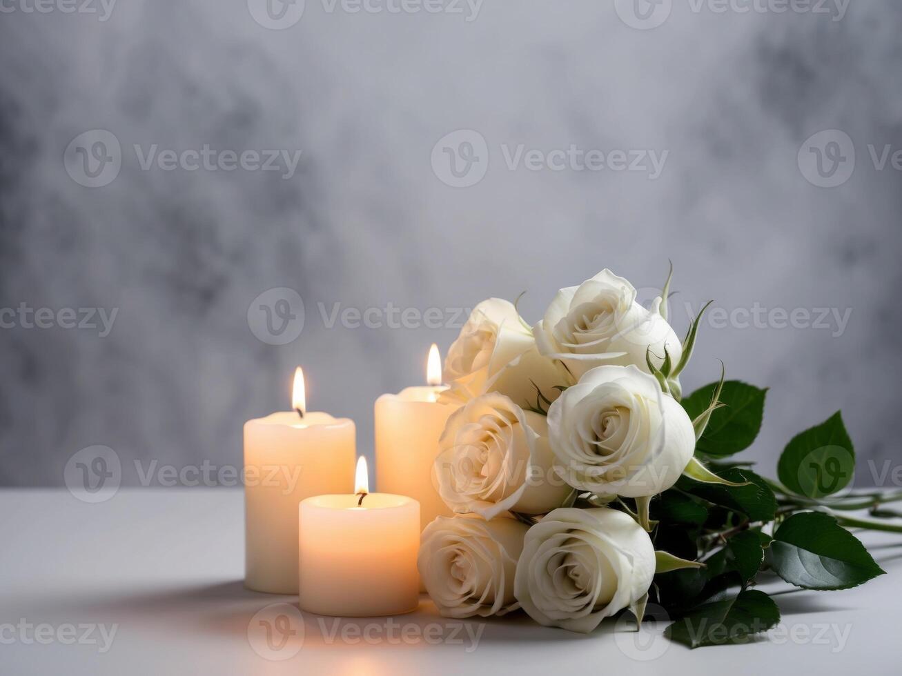 White roses and candles on a table photo
