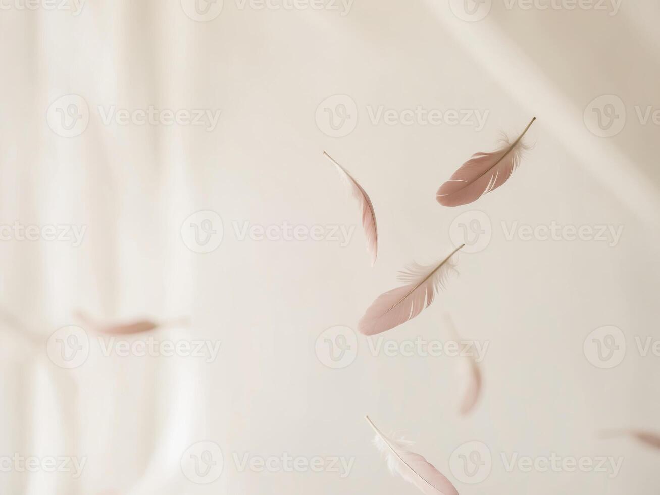 A white sheet with pink feathers flying in the air photo