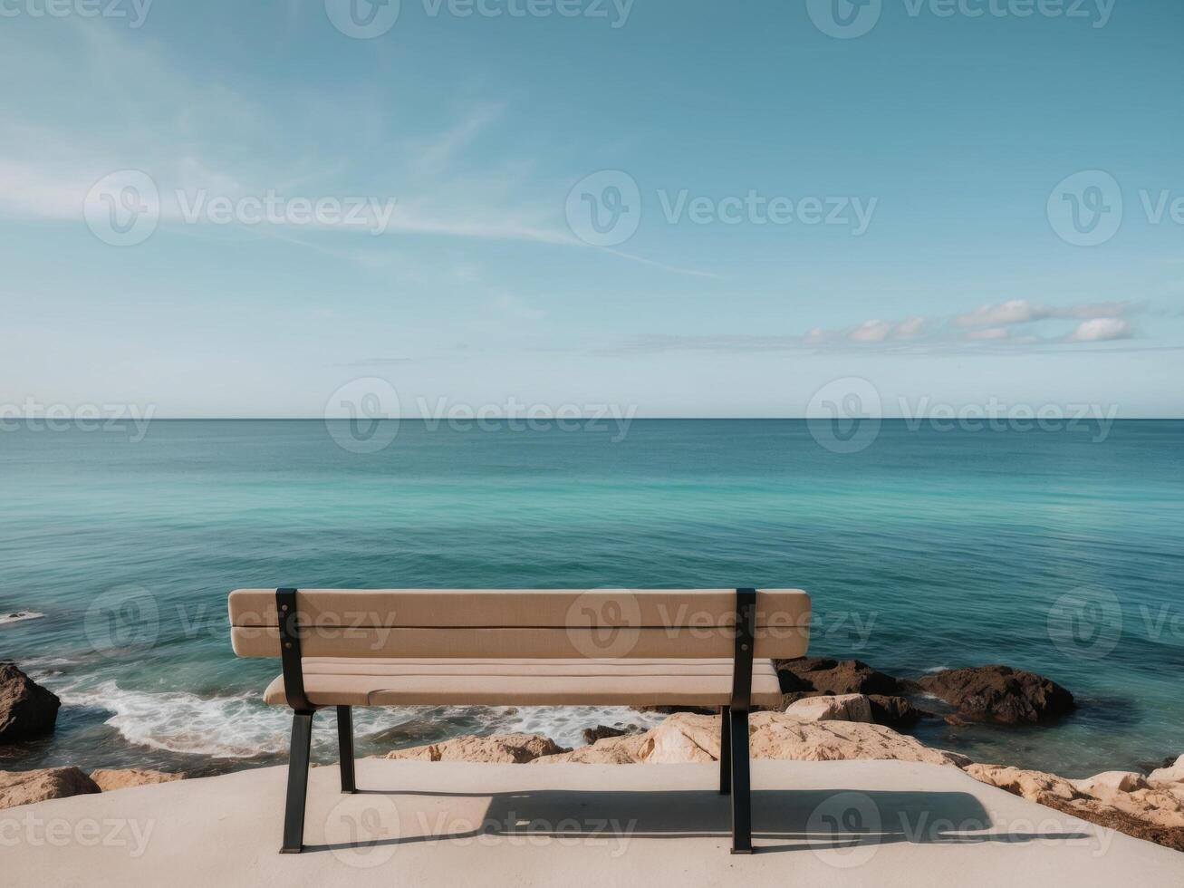 A bench overlooking the ocean photo