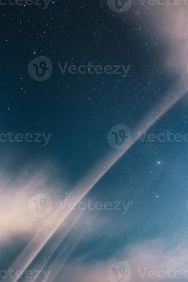 A plane flying over the sky with a long trail photo