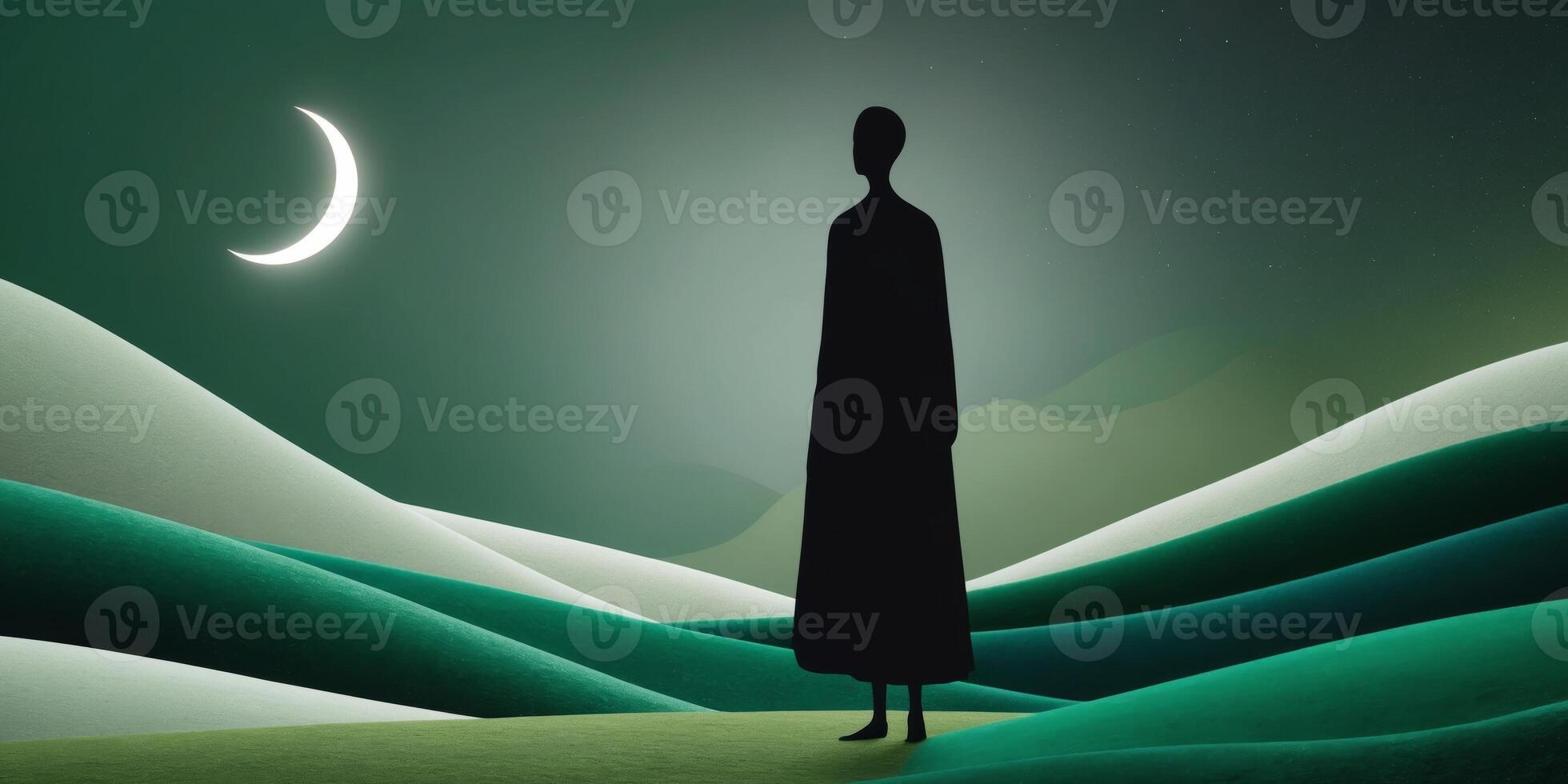 A silhouette of a man standing on a hill with the moon in the background photo