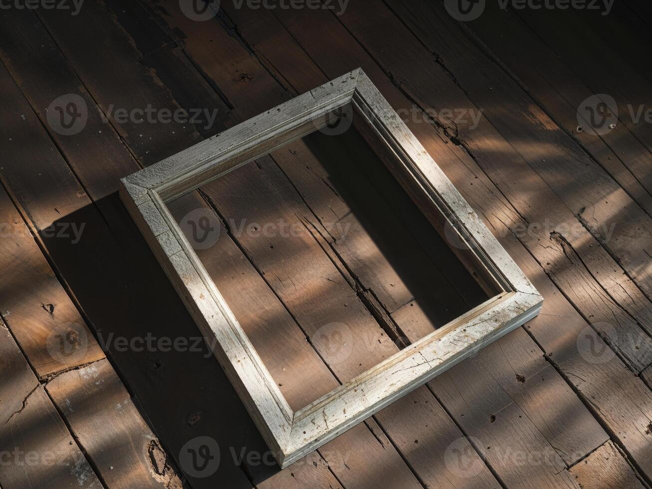 An empty frame on a wooden floor photo