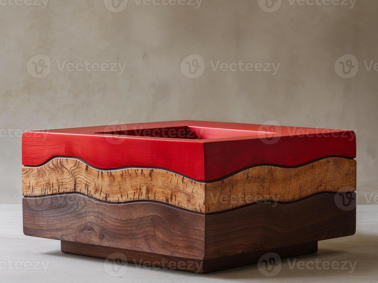 A wooden object with a red top and a brown bottom photo