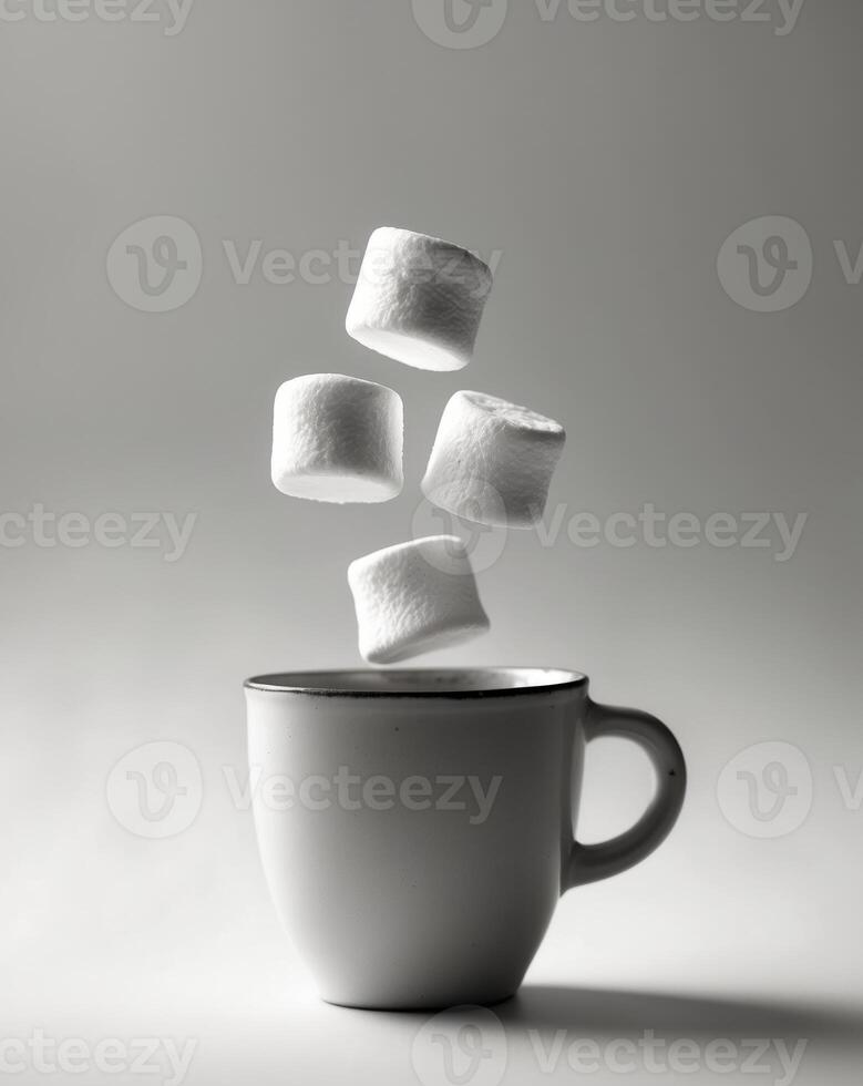 Fluffy Marshmallows Floating Above a Cup photo