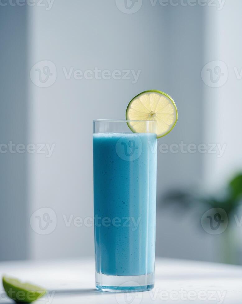 Refreshing Blue Smoothie in a Tall Glass Garnished with Lime photo
