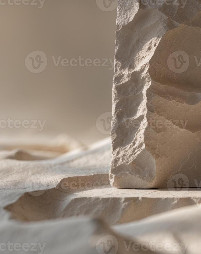 A close up of a rock on a sand surface photo