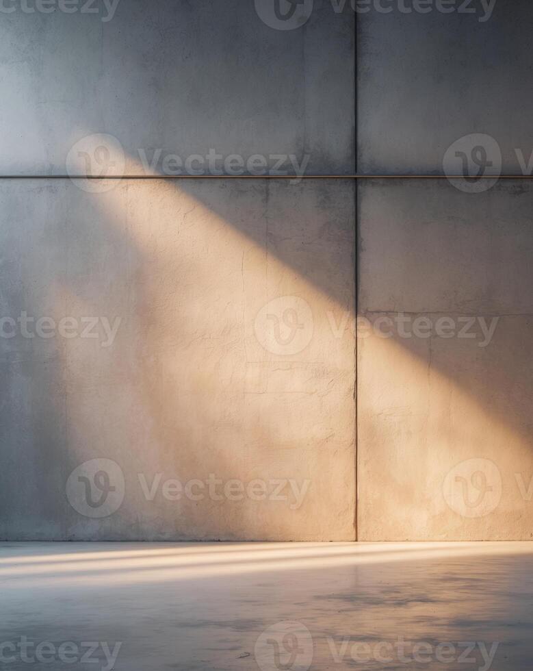 An empty room with concrete walls and a light shining through photo