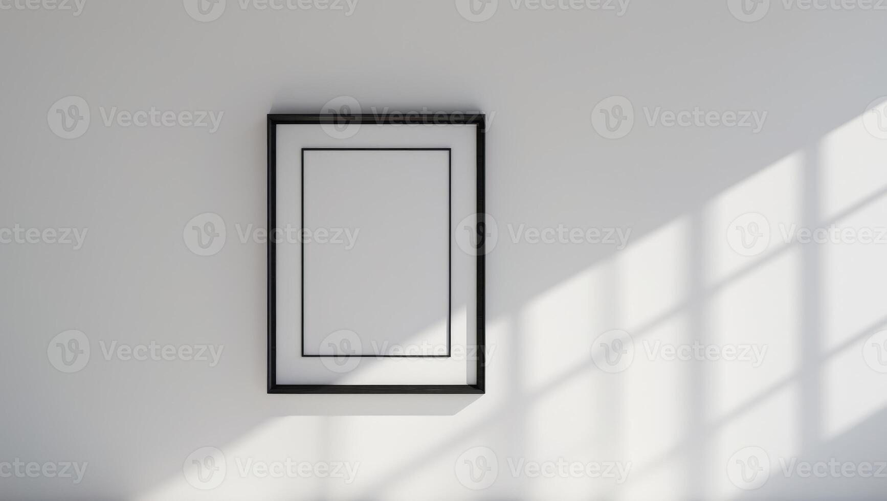 A white wall with a black framed picture photo