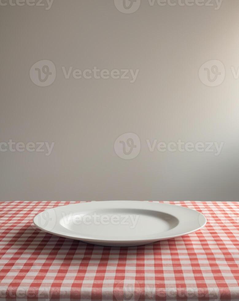 Empty white plate on a checkered red and white tablecloth with ample space for text or design ideas during a casual dining setting photo