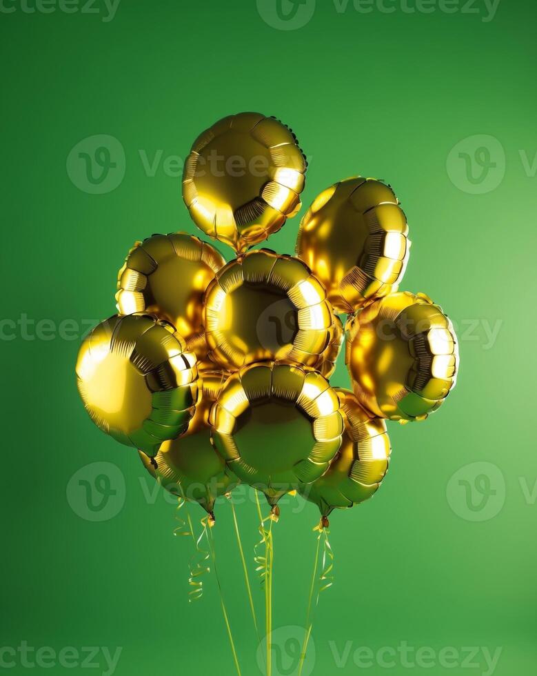 Festive golden yellow foil balloons for celebrating on green background photo