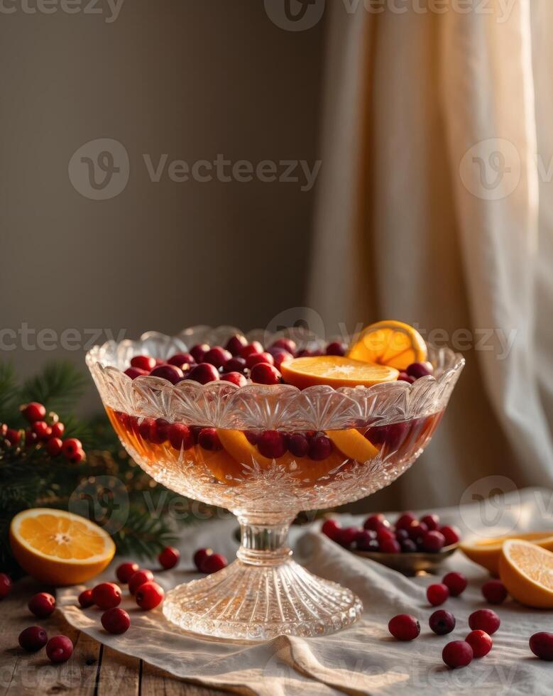 A bowl of cranberry and orange juice with oranges and oranges photo