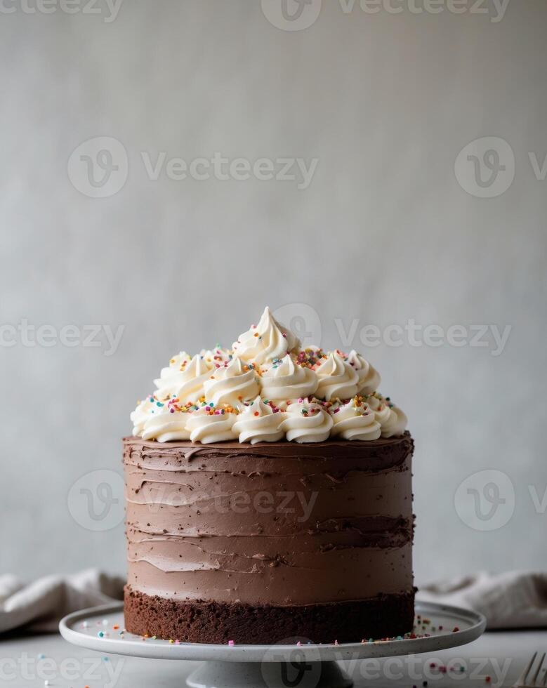 Tall Chocolate Layer Cake with Cream Frosting and Sprinkles photo