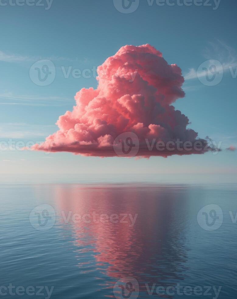 A pink cloud floating in the sky over a body of water photo