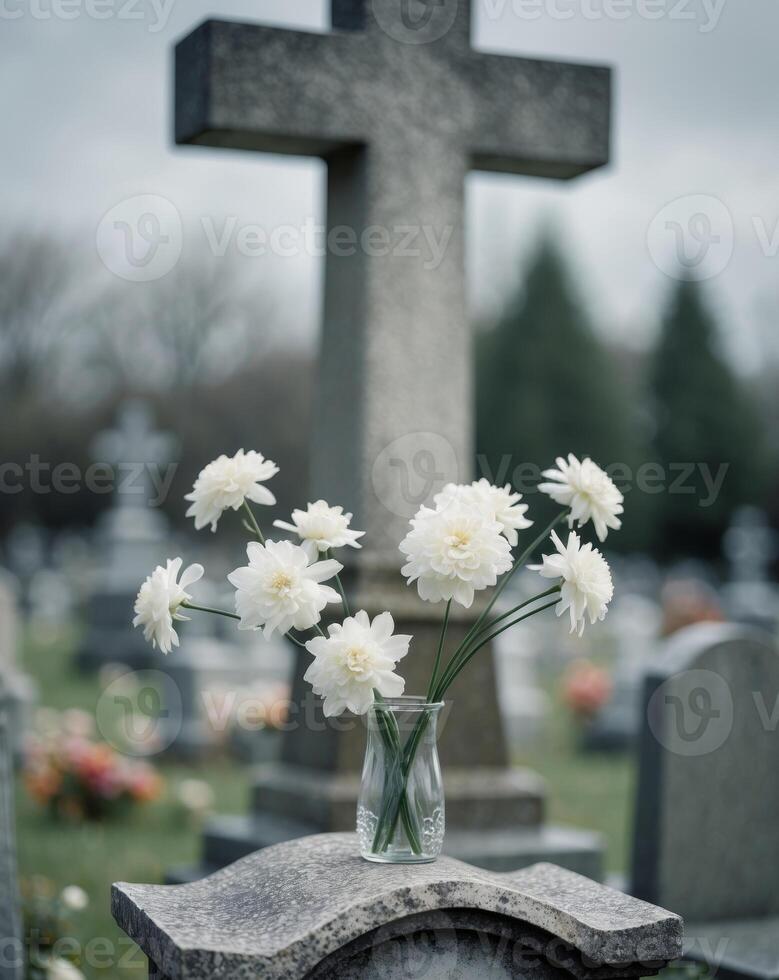 Flowers in a vase on a grave photo