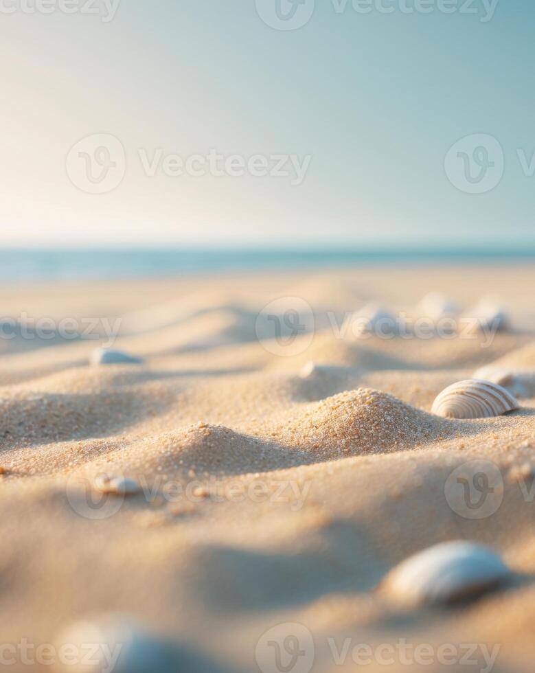 Sand on the summer beach with blurred sea and sky background photo