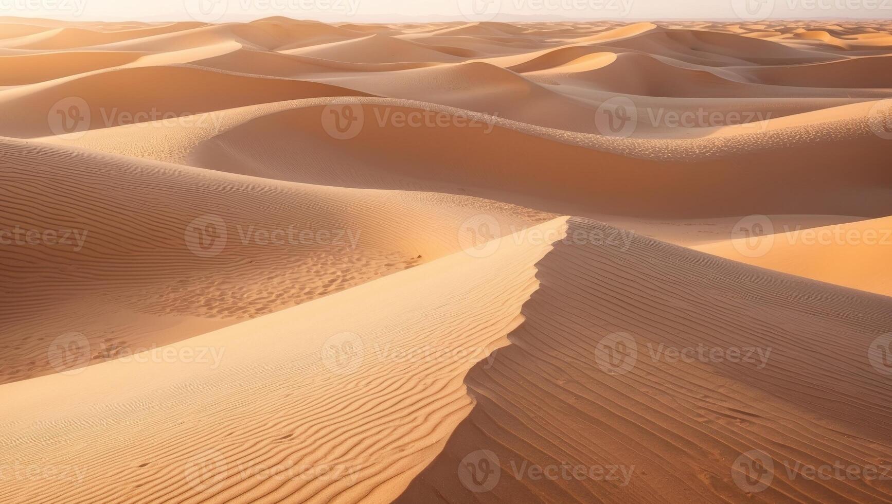 Vast orange desert landscape with gentle sand dunes and ripples photo