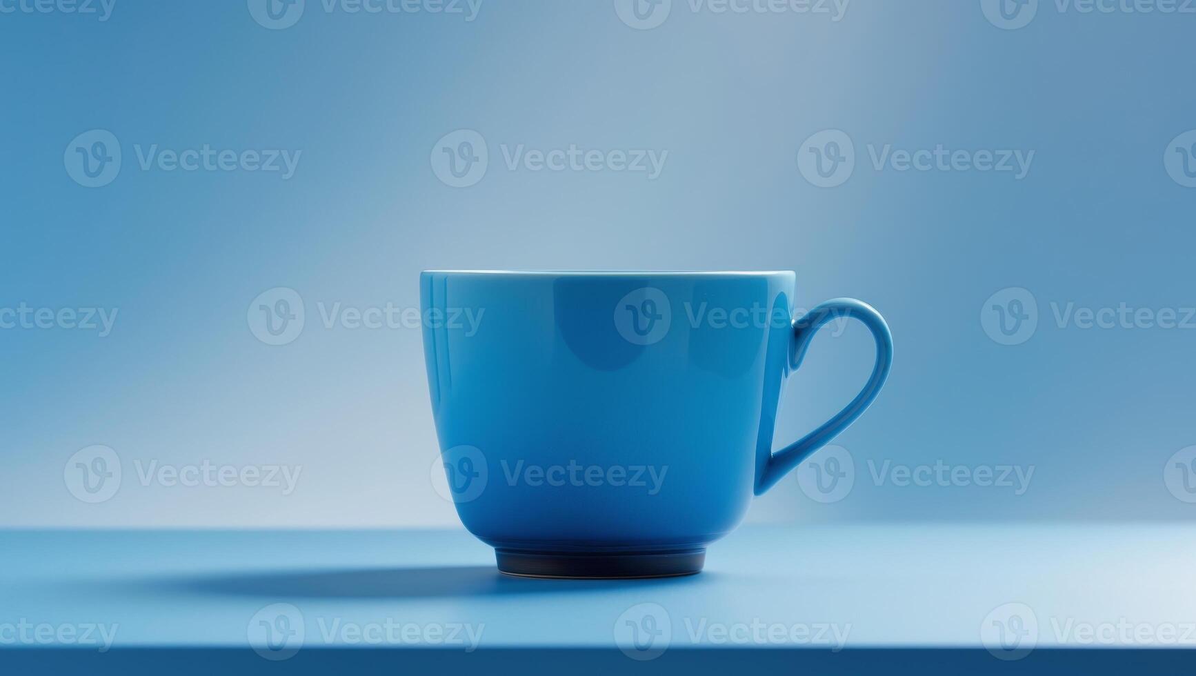 there is a blue cup sitting on a table with a blue background photo