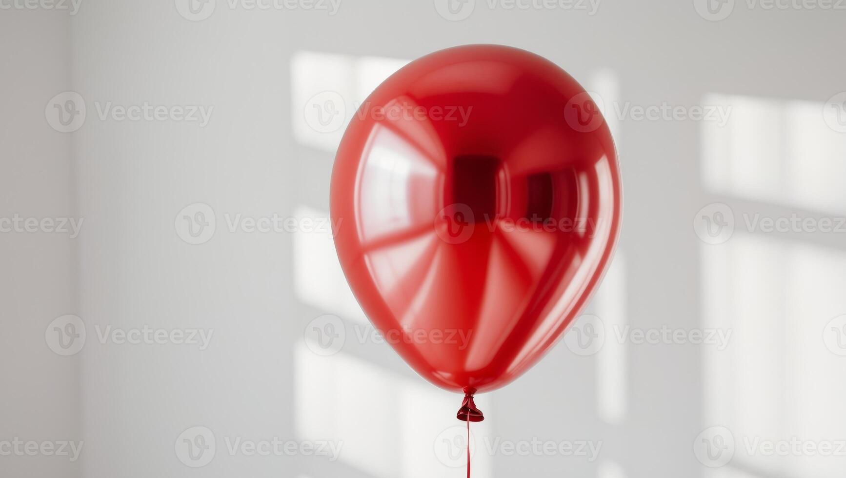 Shiny red balloon with a reflective surface photo