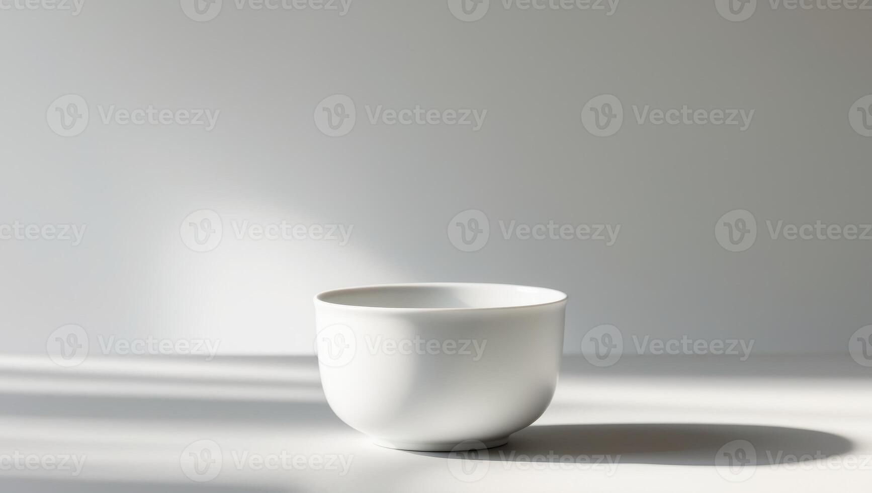 there is a white cup sitting on a table with a shadow photo