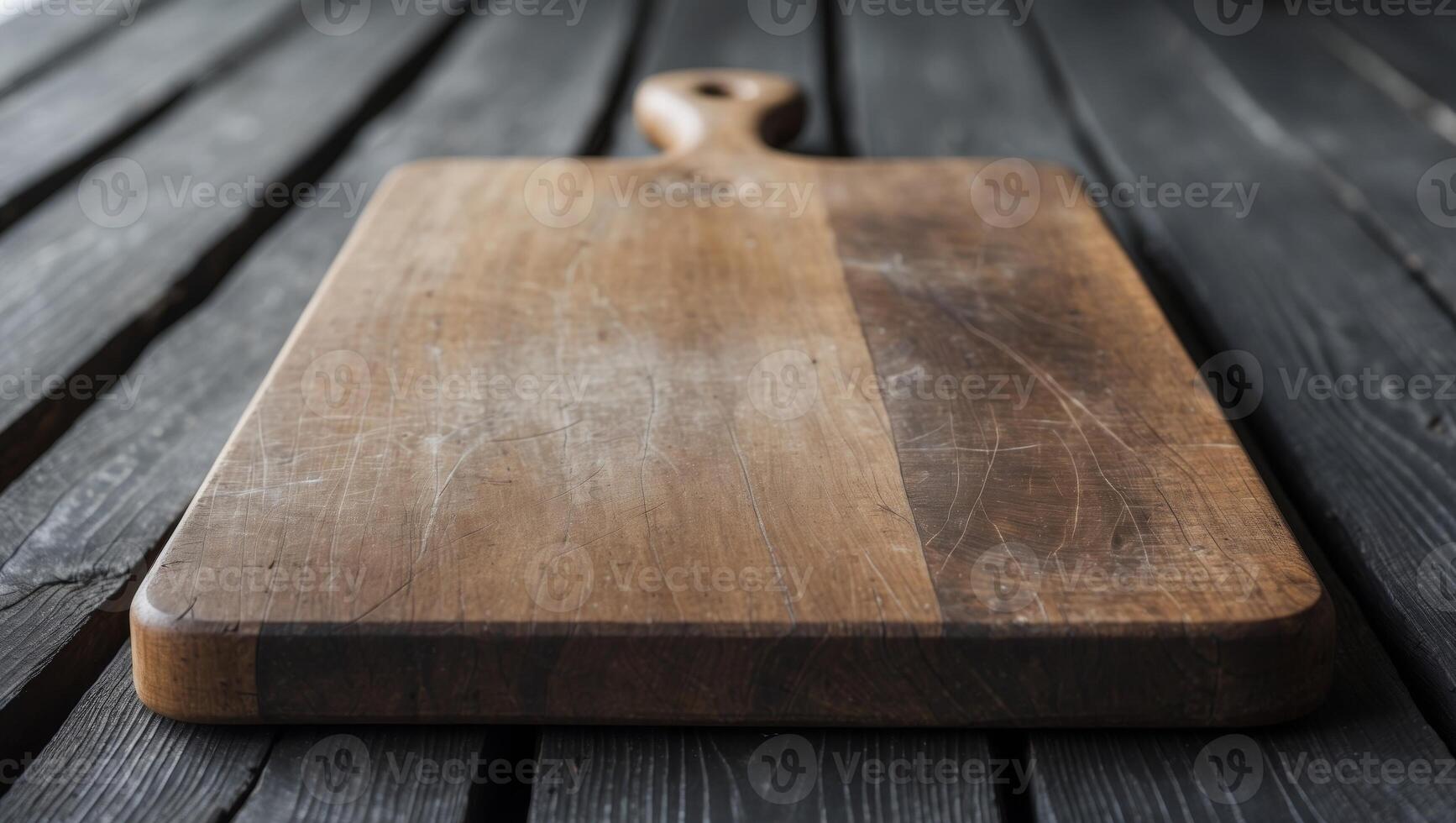 Vintage cutting board on dark wooden planks with no food present photo