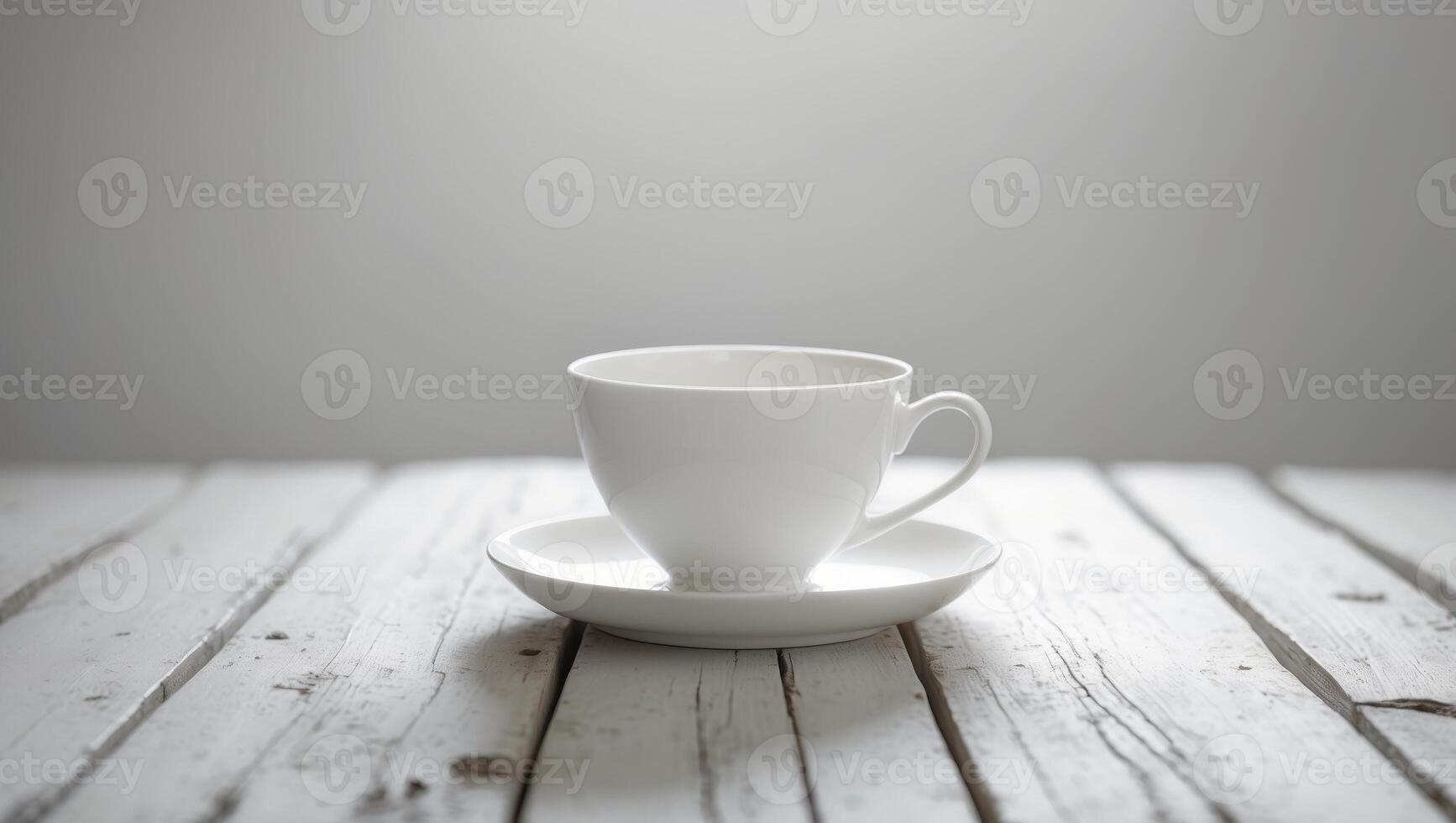 White coffee cup on wooden table photo