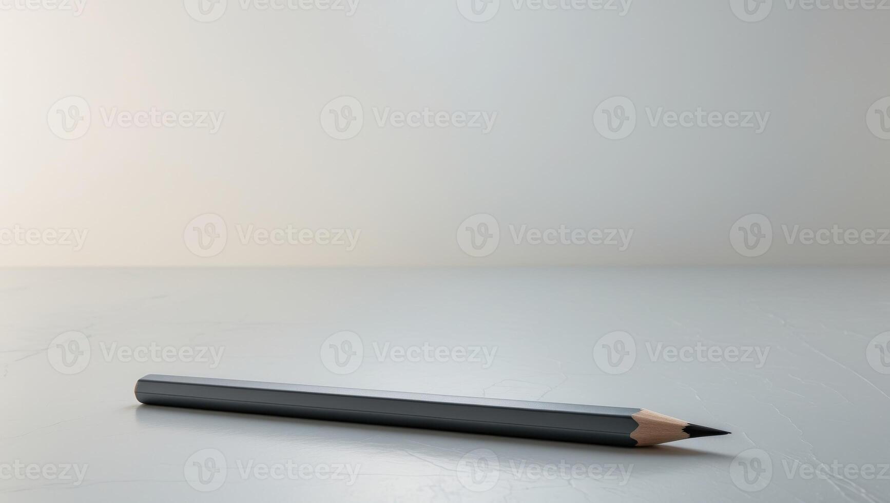 A pencil sitting on a table with a white background photo