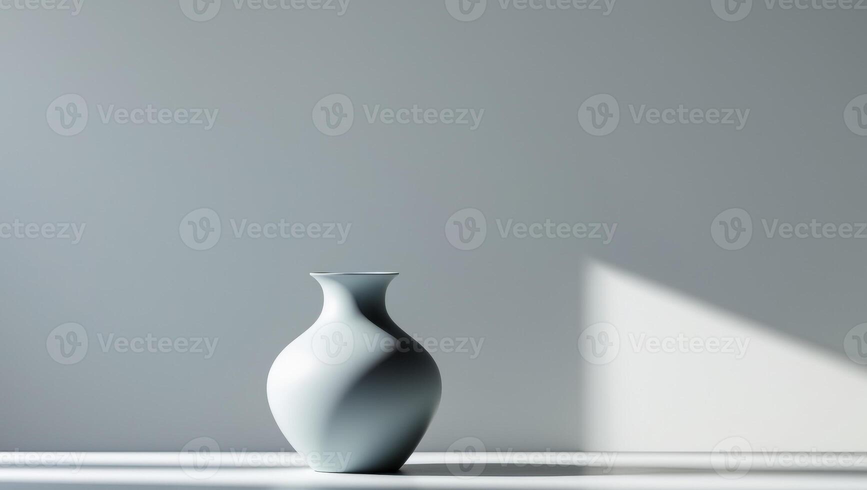 A vase is sitting on a table in front of a wall photo