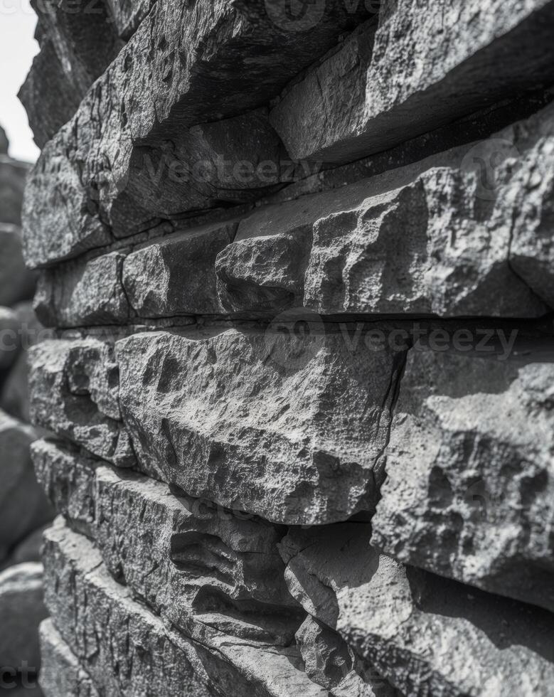 A black and white photo of a stone wall