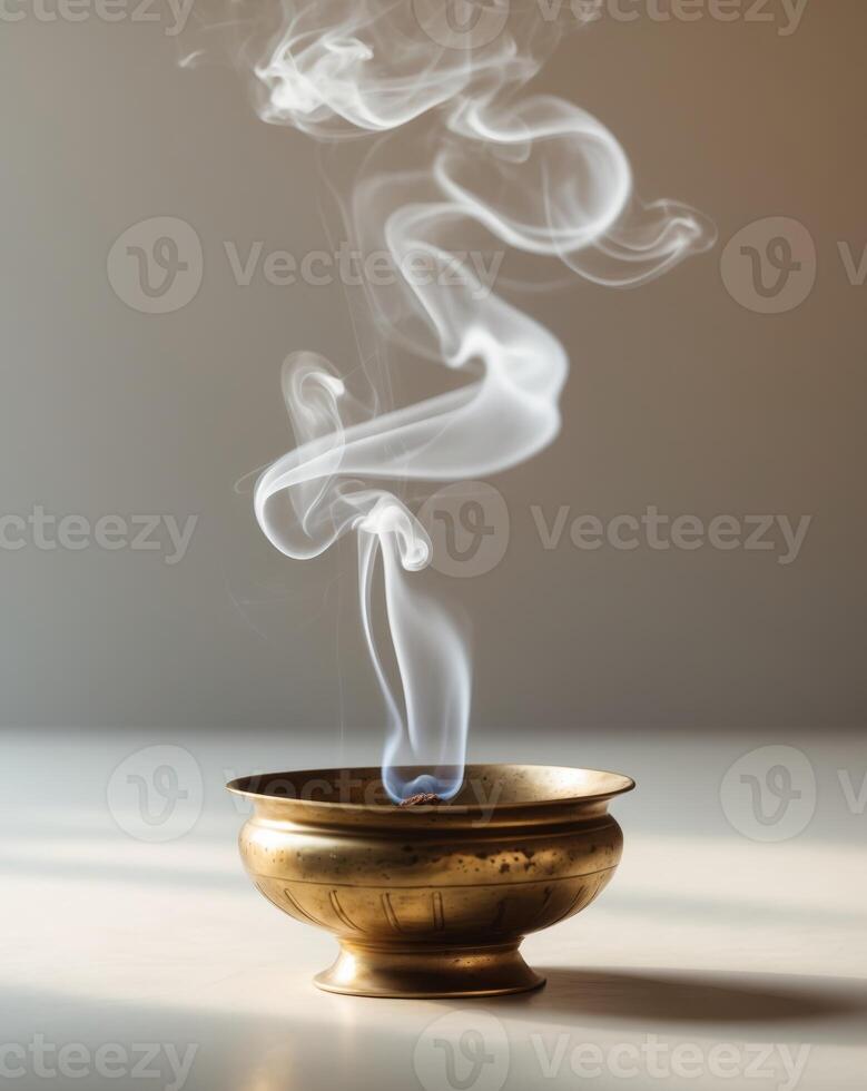 Aromatic Incense Burning in Traditional Brass Bowl photo