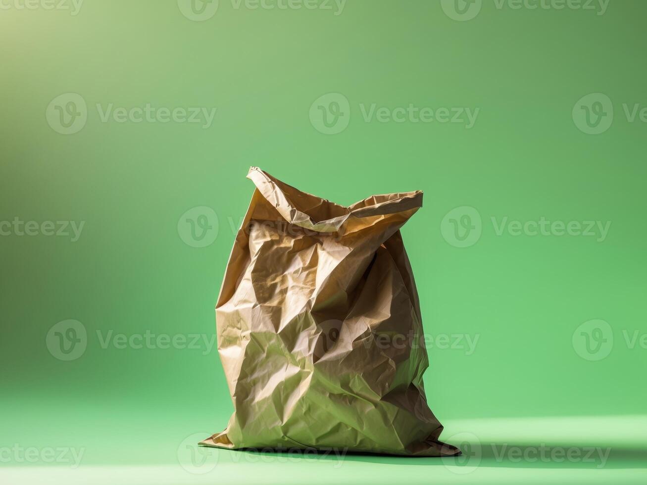 Brown Paper Shopping Bag on Green Backdrop photo