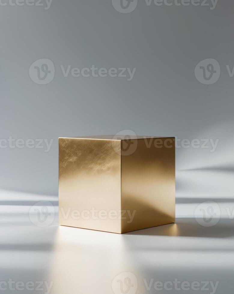 a close up of a golden cube on a gray background photo